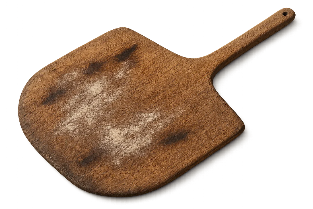 Worn wooden pizza peel